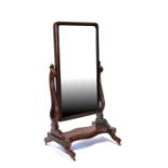 A 19th century mahogany Cheval mirror with pierced scroll supports, 73cms (28.75ins) wide.