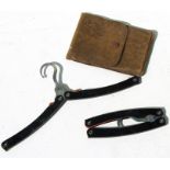 A military campaign leather cased pair of early 20th century nickel silver folding Coat Hangers
