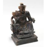 A Chinese gilded lacquer wooden figure depicting a General seated in a throne chair, 27cms (10.5ins)