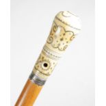 A fine william and mary ivory and pique work handled walking cane, the top of the handle with a