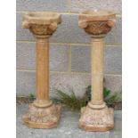 A pair of faux marble or plaster columns on pedestals, approx. 76cms (30ins) high (2). (a/f)