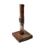 An Art Deco oak and rosewood table lamp, 32cms (12.5ins) high.Condition ReportTwo sections of