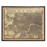 A large print of Stanford's Map of Central London, framed and mounted on hessian, overall 103 by