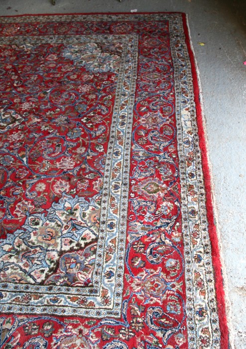 A Persian Mashad hand knotted woollen carpet with central floral medallion within foliate borders, - Image 2 of 3