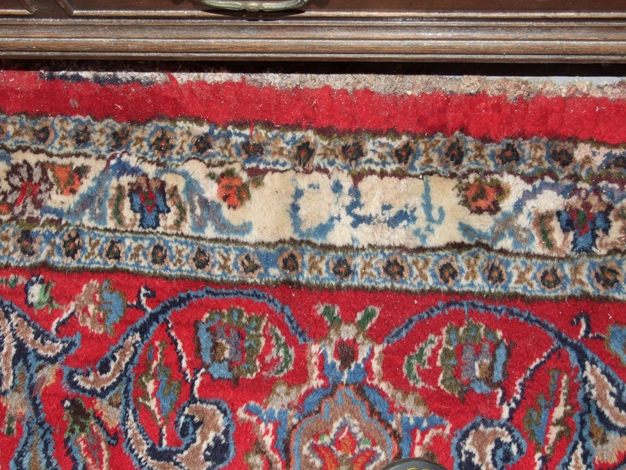 A Persian Mashad hand knotted woollen carpet with central floral medallion within foliate borders, - Image 3 of 3