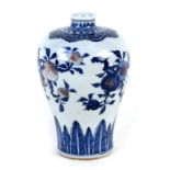 A Chinese blue & copper red meiping vase decorated with peaches, 22cms (8.75ins) high.Condition