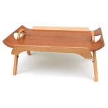 A mid 20th century design Centurion teak and beech folding bed table, 59cms (23.25ins) wide.