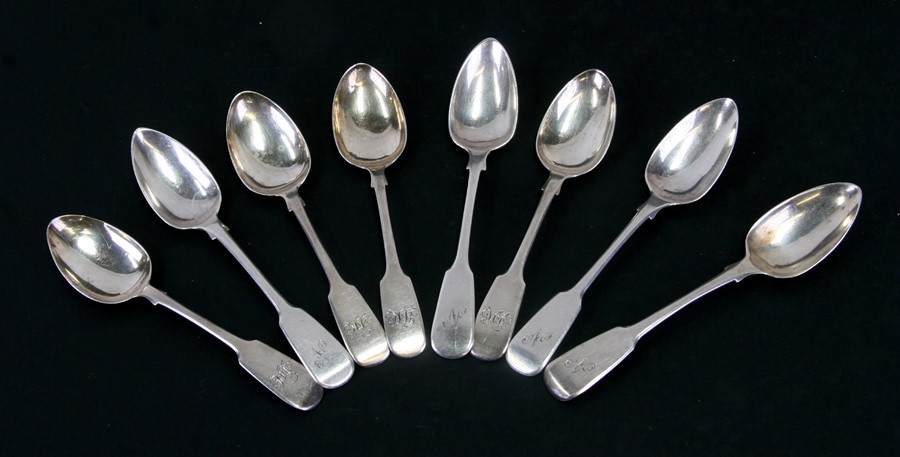 A matched set of George III silver fiddle pattern teaspoons, initialled, various dates and makers,