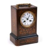 A late 19th century inlaid rosewood French mantle clock, the white enamel dial with Roman