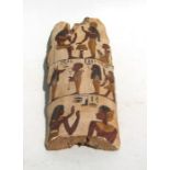 An Egyptian polychrome painted wooden fragment depicting figures, 13 by 30cms (5 by 12ins).