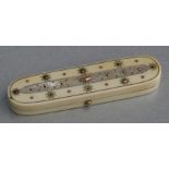 A Georgian ivory toothpick box with mother of pearl and yellow metal decoration, 8.5cms (3.25ins)