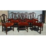 A set of ten 19th century mahogany dining chairs with shield backs and stuff-over seats, on square