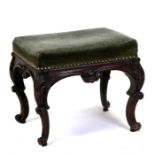 A 19th century mahogany footstool with upholstered seat on acanthus capped cabriole legs, 46cms (