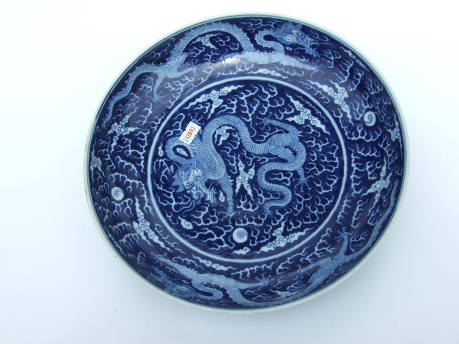 A Chinese blue & white charger decorated with precious objects beside a tree, 32cms (12.5ins) - Image 7 of 10