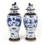 A pair of Chinese crackle glaze vases of baluster form decorated with dragons chasing a flaming
