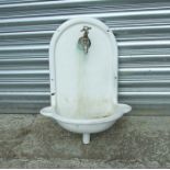 A French cast iron wall mounted enamel sink with cold water tap, 46cms (18ins) wide.Condition