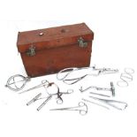 A quantity of midwives surgical equipment in a leather case, initialled 'CJS', 45cms (17.5ins)