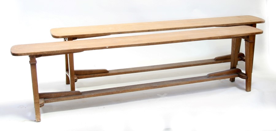 A pair of elm benches on square tapering legs joined by a stretcher, 206cms (81ins) long (2).