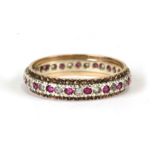A 9ct gold eternity ring set with rubies and diamonds, weight 2.4g, approx UK size 'N'.