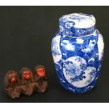 A Japanese blue & white ginger jar and cover decorated with flowers and fruits, 20cms (8ins) high;