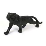 A Japanese bronzed metal figure depicting a snarling tiger, 27cms (10.5ins) long.