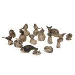 A quantity of Poole Pottery stoneware animals to include a seal, a mouse on an apple, a fawn and