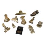 A group of Victorian and later novelty letter clips.