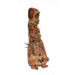 A textile straw filled folk art figure depicting Mrs Punch, 59cms (23.25ins) high.