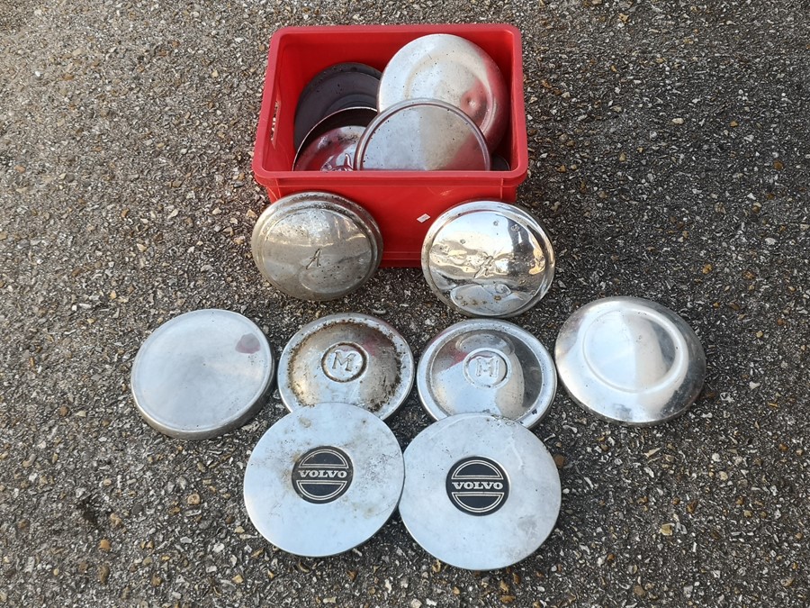 A collection of chrome hub caps for various models including Riley, Morris and Volvo.