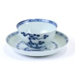 An 18th century Chinese Export blue & white tea bowl and saucer from the Nanking Cargo, bearing