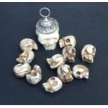 A carved bone skull form pendant; together with a quantity of bone skull form loose beads.