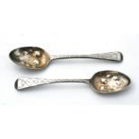 A matched pair of George III silver berry spoons, marks rubbed, weight 42g; together with a cut