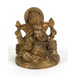 An Indian brass / bronze seated figure of Ganesh, 8cms (3ins) high.