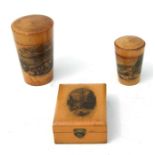 Two Victorian Mauchline ware glass beaker cases; together with a pocket watch stand containing a