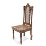 An Anglo-Indian chair with bone and ebony inlay, with caned seat and back.Condition Reportback