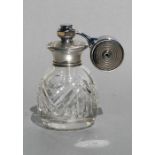 A silver mounted cut glass perfume atomiser, Birmingham 1959, 11cms (4.25ins) high.