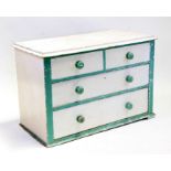 A painted pine chest of two short and two graduated long drawers, 105cms (41.25ins) wide.