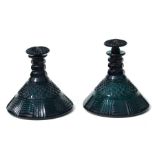 A pair of 19th century facet cut green glass ships decanters and stoppers, 20cms (8ins) diameter (