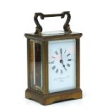 A four-pillar gilt brass carriage clock, the rectangular enamel with Roman numerals and signed 'H