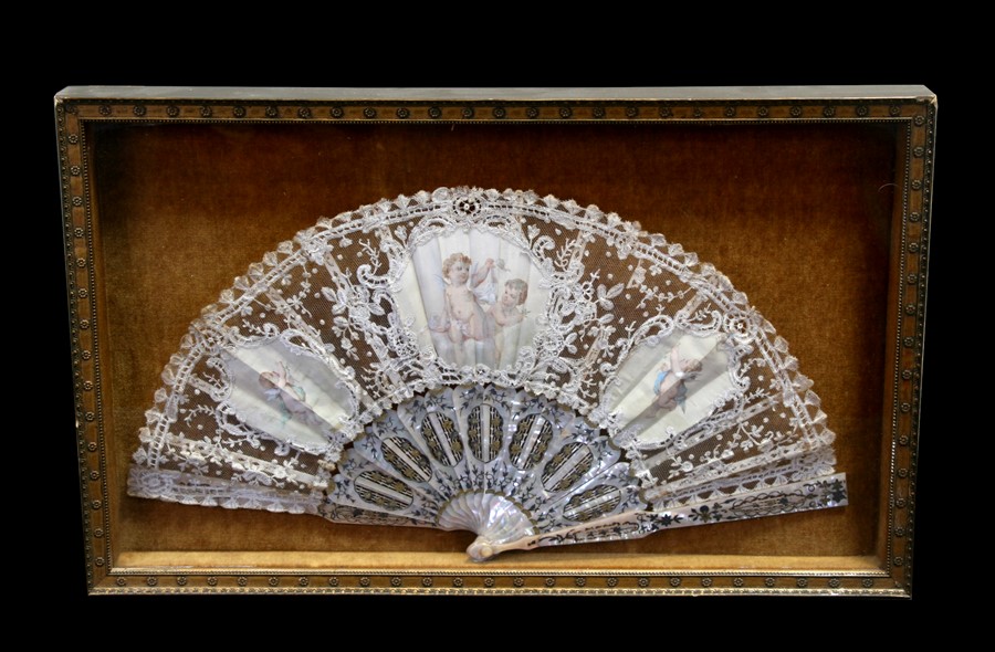 A 19th century fan with mother of pearl sticks and lace leaf decorated with three vignettes with