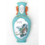 A Chinese half vase wall plaque decorated with a figure in a river landscape with calligraphy, on