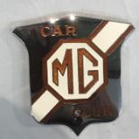 MG interest: a set of four cast aluminium wheel centres, an MG Car Club enamel and chrome badge