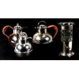 An Art Nouveau silver plated vase; together with three silver plated Guernsey jugs, the largest