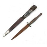 A Fairbairn Sykes commando type knife in a leather scabbard, 28.5cms (11.75ins) long.Condition