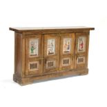 A Spanish walnut sideboard with four carved panelled door, each depicting a figural scene, 143cms (