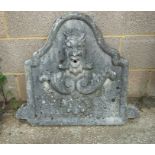 A well weathered stoneware fountain head with central grotesque mask, 65cms (25.5ins) high.