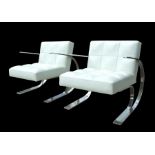 A pair of Andrew Martin design white leather and chrome mid century inspired armchairs (2).