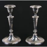 A tall pair of Adams style silver candlesticks of oval form, London 1897 and makers mark for William