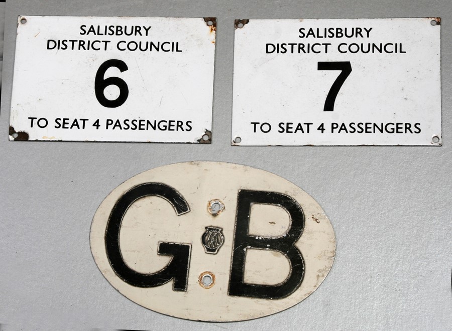 A Salisbury District Council enamel taxi licence plaque, No. 6 To Seat 4 Passengers, 10 by 15cms (