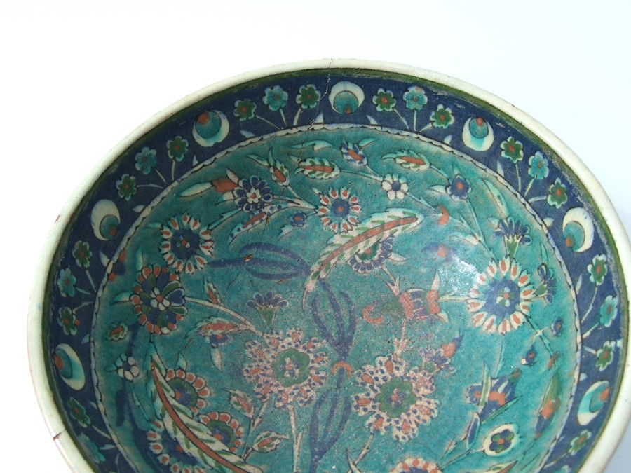 An Iznik pottery bowl decorated with flowers on a green ground, 27cms (10.5ins) diameter; together - Image 17 of 17